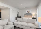 Thumbnail 20 of 50 - a living room with a couch and a chair