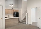 Thumbnail 34 of 50 - a kitchen and stairs in a house