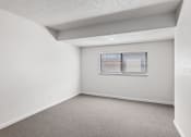 Thumbnail 38 of 50 - an empty room with white walls and a window