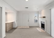 Thumbnail 46 of 50 - a living room with a fireplace and a white door