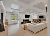Thumbnail 10 of 51 - the living room has a fireplace and a large white couch