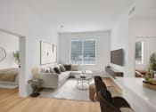 Thumbnail 39 of 51 - a living room with a couch and a tv