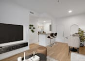 Thumbnail 51 of 51 - a living room with a large tv and a kitchen in the background