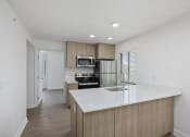 Thumbnail 50 of 56 - a kitchen with a large white counter top