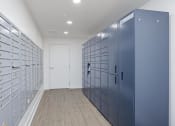 Thumbnail 21 of 56 - a row of lockers in a hallway with a door at the end