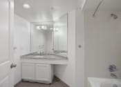 Thumbnail 54 of 56 - a bathroom with a sink and a bathtub