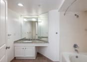 Thumbnail 45 of 56 - a bathroom with a sink and a bathtub