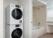 Thumbnail 44 of 56 - a washer and dryer in a bathroom