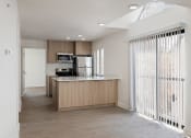 Thumbnail 38 of 56 - a kitchen with wood floors and white walls