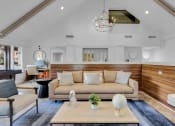Thumbnail 22 of 61 - a living room with a couch and a coffee table at AVIA Lofts on Liberty Ridge, Jacksonville, FL, 32256