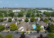 Thumbnail 4 of 34 - an aerial view of a neighborhood with houses and a swimming pool