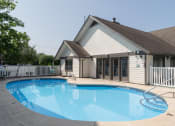 Thumbnail 1 of 34 - a swimming pool in front of a house