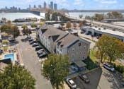 Thumbnail 30 of 45 - an aerial view of a building with a river and a city in the background