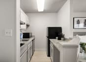 Thumbnail 9 of 45 - our apartments offer a kitchen with stainless steel appliances and granite counter tops