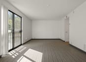 Thumbnail 51 of 92 - the living room of an apartment with a large window at AVIA Lofts on Parkway Apartments, Vancouver, Washington