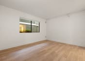 Thumbnail 42 of 92 - a spacious living room with a window and wood flooring at AVIA Lofts on Parkway Apartments, Vancouver, WA