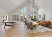 Thumbnail 5 of 92 - a living room with a couch table and a pool table at AVIA Lofts on Parkway Apartments, Vancouver, 98662