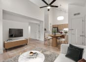 Thumbnail 7 of 92 - a living room with a couch and a table and a tv at AVIA Lofts on Parkway Apartments, Vancouver, WA, 98662