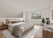 Thumbnail 19 of 92 - A well-lit bedroom with a large bed and a window showing greenery outside.
