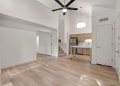 Thumbnail 59 of 92 - an open living room and kitchen with a ceiling fan at AVIA Lofts on Parkway Apartments, Vancouver, 98662