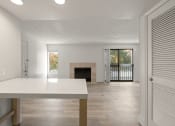 Thumbnail 65 of 92 - the living room and dining room of a house with a fireplace at AVIA Lofts on Parkway Apartments, Vancouver