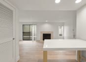 Thumbnail 67 of 92 - the living room and dining room of a house with a white table and a fireplace at AVIA Lofts on Parkway Apartments, Washington, 98662