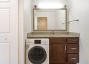 Thumbnail 68 of 108 - a bathroom with a washer and dryer