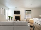 Thumbnail 43 of 108 - a living room with a couch and a tv above a fireplace