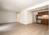 Thumbnail 67 of 108 - a kitchen and living room in a 555 waverly unit