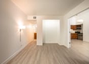 Thumbnail 65 of 108 - a bedroom with hardwood floors and white walls