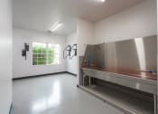 Thumbnail 36 of 108 - a large room with white walls and a large window