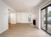 Thumbnail 60 of 108 - a bedroom with hardwood floors and white walls