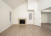 Thumbnail 56 of 108 - an empty living room with a fireplace