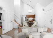 Thumbnail 41 of 108 - a living room with a couch and a table