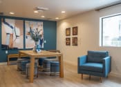 Thumbnail 16 of 108 - a room with a table and chairs and a large painting on the wall