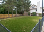Thumbnail 11 of 108 - a fenced in yard with a house in the background