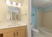 Thumbnail 94 of 108 - a bathroom with a sink and a toilet and a shower