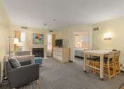 Thumbnail 99 of 108 - a living room and dining area in a hotel room