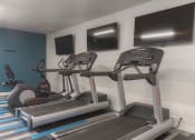 Thumbnail 28 of 108 - two treadmills and two televisions in a gym room