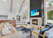Thumbnail 20 of 61 - a living room with a couch and a fireplace at AVIA Lofts on Liberty Ridge, Jacksonville, FL, 32256