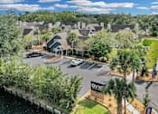 Thumbnail 17 of 61 - an aerial view of a neighborhood with houses and a parking lot at AVIA Lofts on Liberty Ridge, Florida, 32256
