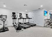 Thumbnail 29 of 61 - the gym with treadmills and weights and a map on the wall at AVIA Lofts on Liberty Ridge, Florida