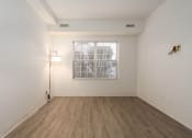Thumbnail 81 of 108 - an empty room with white walls and wood flooring and a window