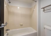 Thumbnail 72 of 108 - a bathroom with a shower and a toilet and a sink