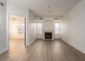Thumbnail 85 of 108 - the living room and dining room of an empty house with a fireplace