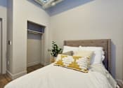 Thumbnail 51 of 55 - Bedroom with cozy bed at Brickside Heights Apartments, Millcreek, UT, 84106