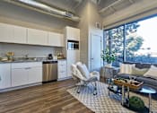 Thumbnail 50 of 55 - Kitchen and living at Brickside Heights Apartments, Millcreek, UT