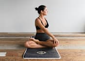 Thumbnail 25 of 61 - A woman is doing yoga at Bautista Apartments, Arizona