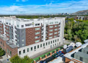 Thumbnail 64 of 71 - a large white building with many windows and a sign on the side of the building that says at Wilmington Flats Apartments, Salt Lake City, UT, 84106
