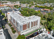 Thumbnail 69 of 71 - a view from above of a large white building with a red brick facade at Wilmington Flats Apartments, Utah, 84106